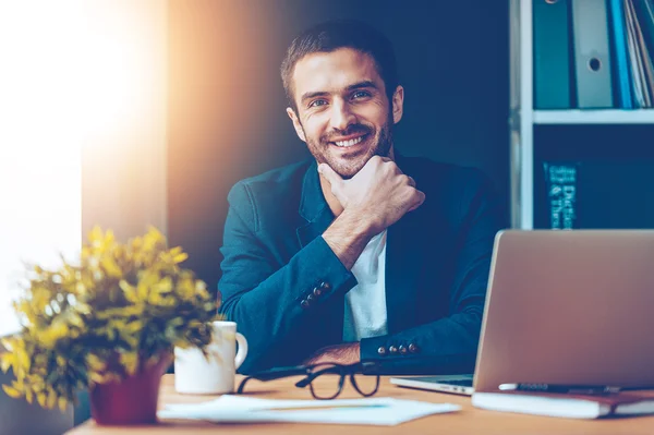 Man sitting at his working place in office — Stock Photo, Image