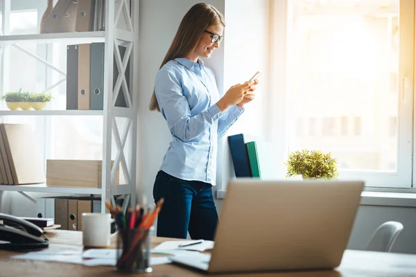 Young beautiful businesswoman with phone — Stock Photo, Image