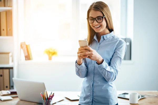 Young beautiful businesswoman with phone — Stock Photo, Image