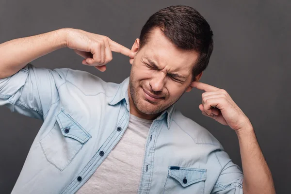 Man covering ears — Stock Photo, Image