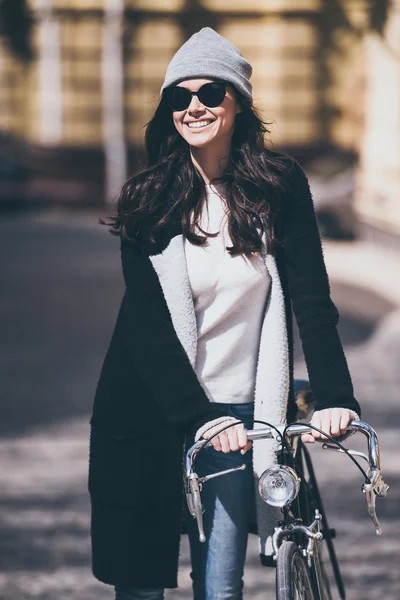 Beautiful woman with bicycle — Stock Photo, Image