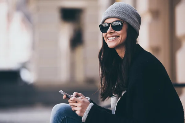 woman using smartphone outdoors