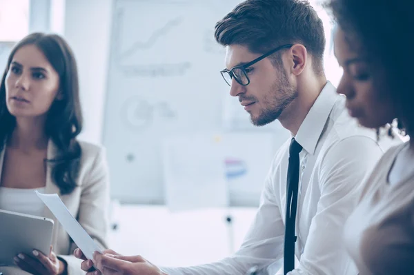 Handsome man reading document — Stock Photo, Image