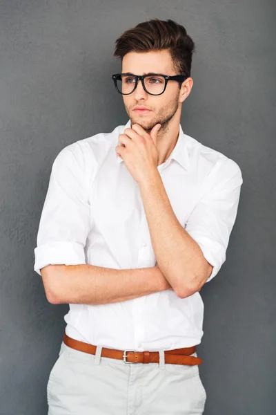 Handsome man keeping hand on chin — Stock Photo, Image