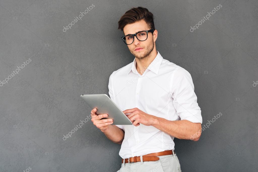 handsome man using his digital tablet