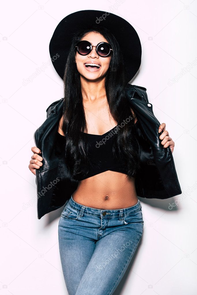 Beautiful woman in leather jacket and hat 