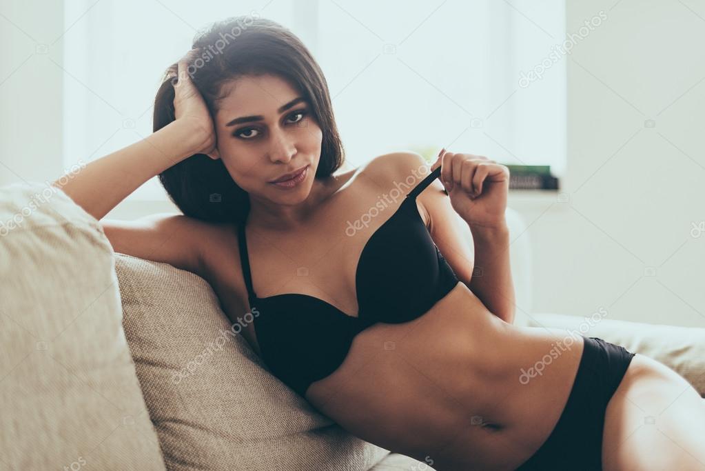 Beautiful young woman in black lingerie