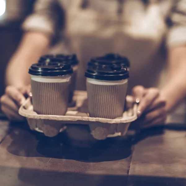 Woman serving coffee — Stock Photo, Image