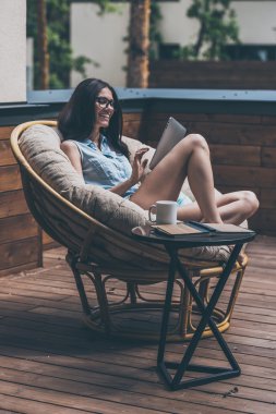 woman working on her digital tablet