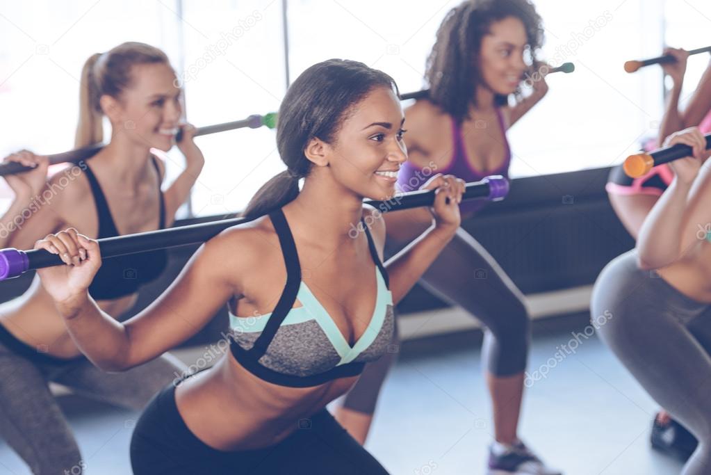 Women  exercising with barre