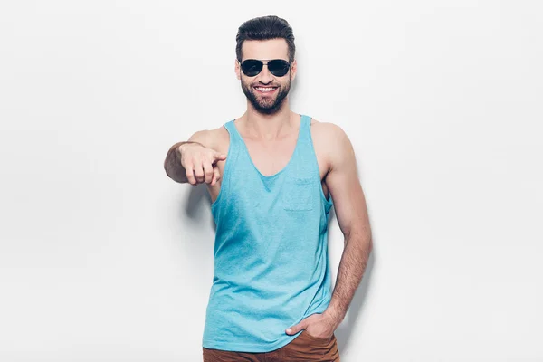 Man in sunglasses pointing you and smiling — Stock Photo, Image