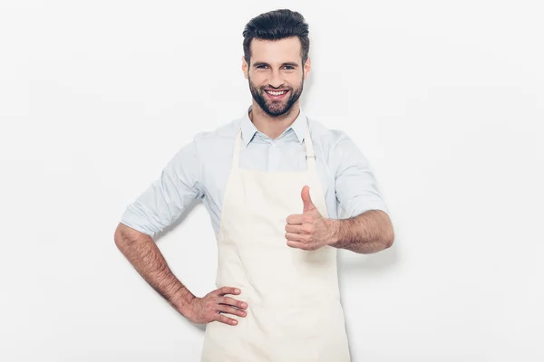 Man  in apron show sign good thumb up — Stock Photo, Image