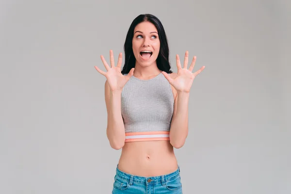 Woman keeping mouth open and gesturing — Stock Photo, Image