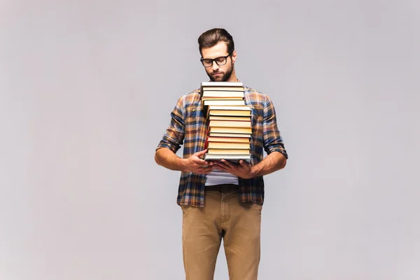 Adam taşıma kitap yığını — Stok fotoğraf