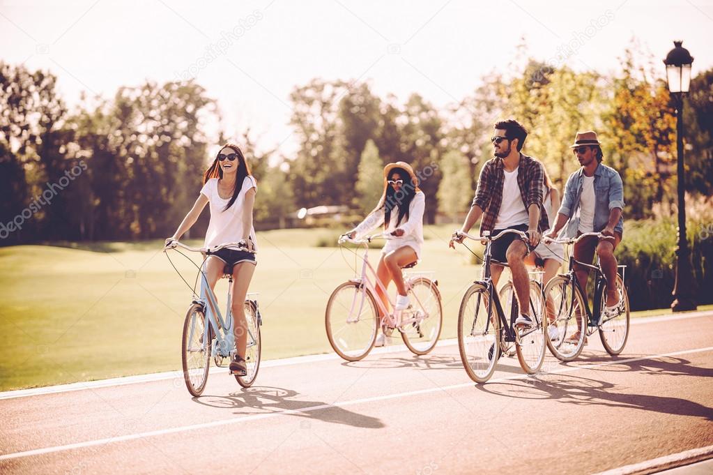 young people riding bicycles