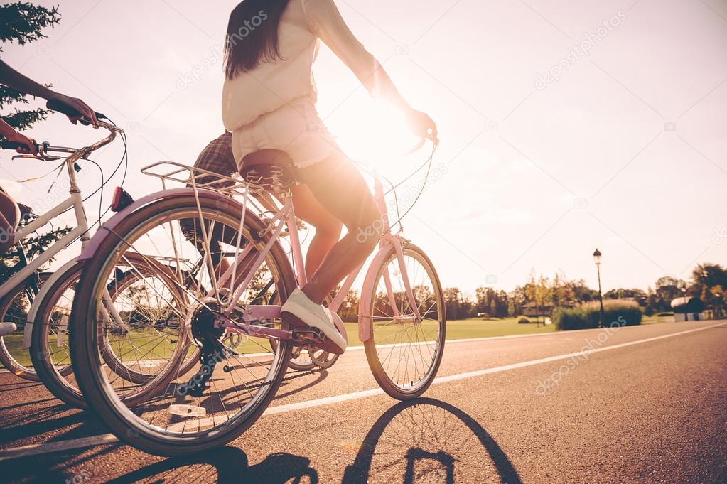 young people riding bicycles