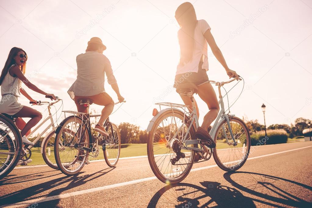 young people riding bicycles 
