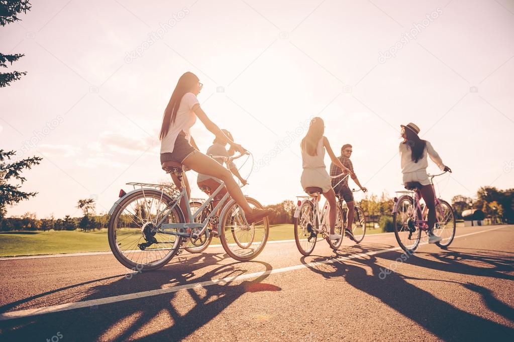 young people riding bicycles 