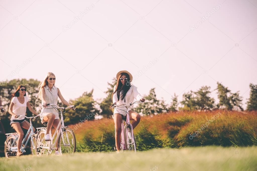 young women riding bicycles