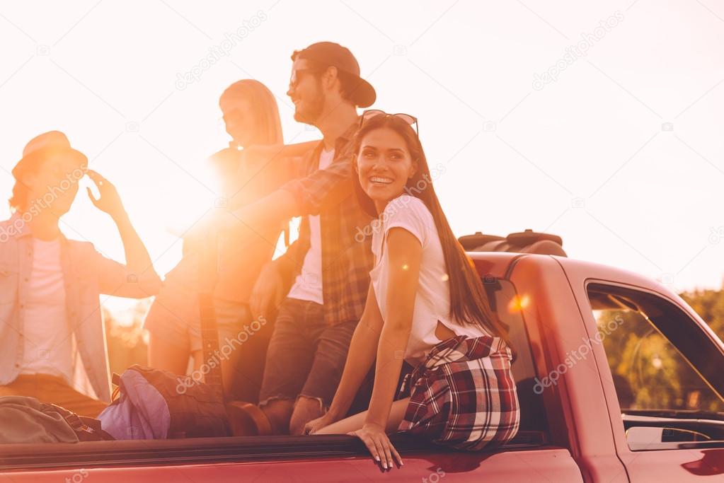 cheerful people enjoying their road trip