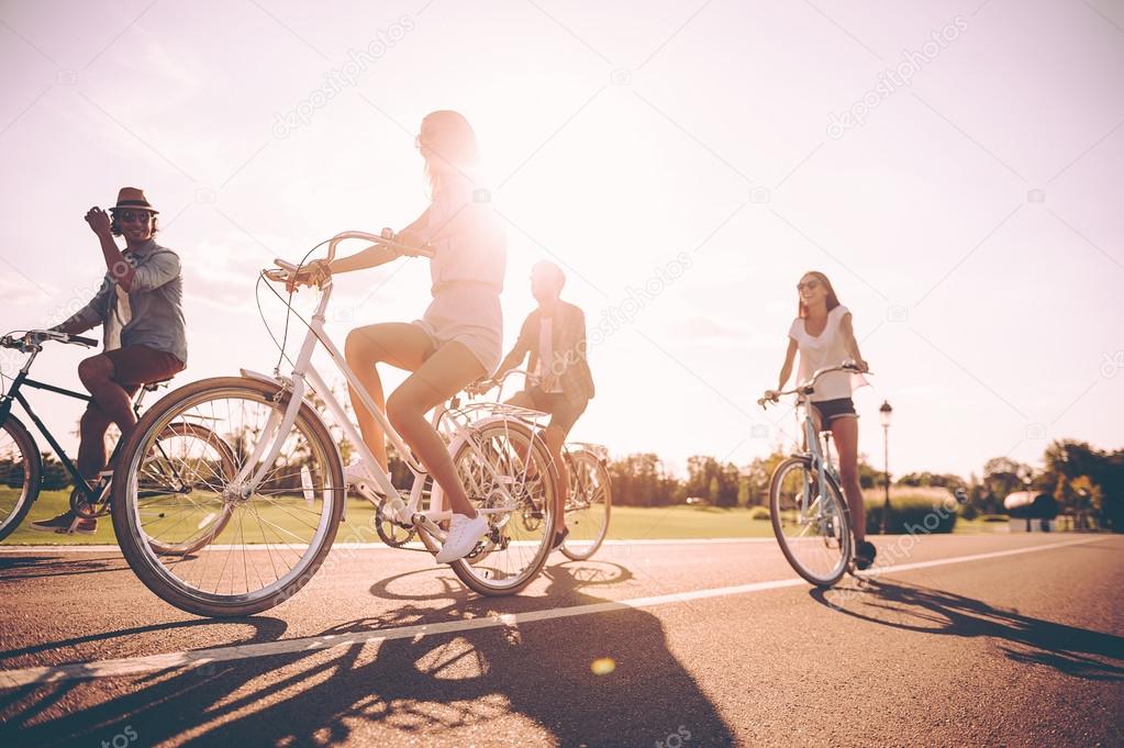  young people riding bicycles