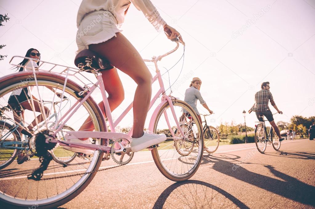  cheerful people riding bicycles 