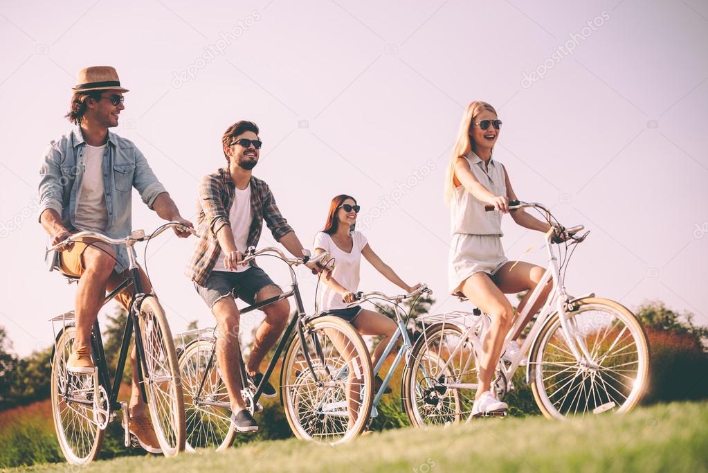 Group of young people riding bicycles 