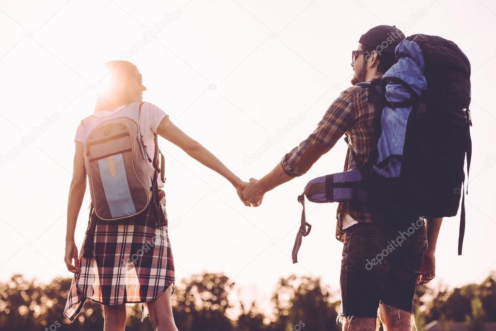 young couple with backpacks 