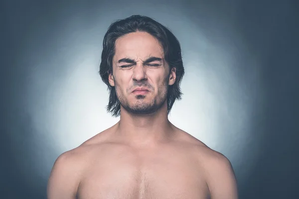 Shirtless man keeping eyes closed — Stock Photo, Image