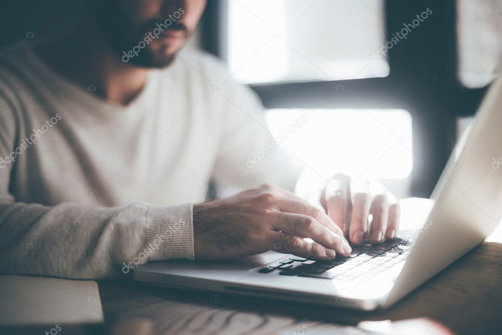 handsome man working with laptop