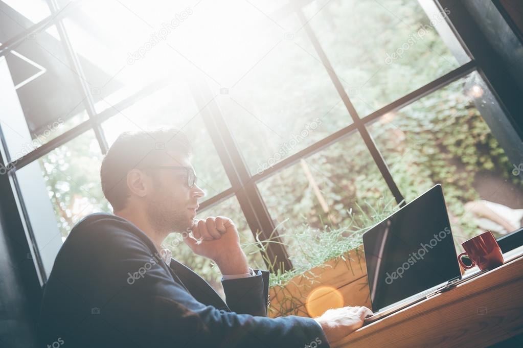 handsome man working with laptop