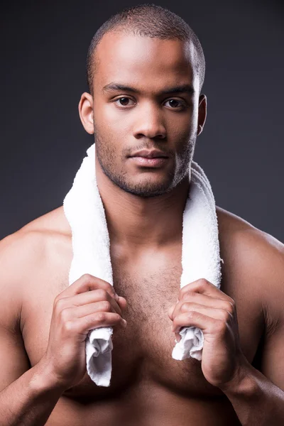 African man carrying towel on shoulders — Stock Photo, Image