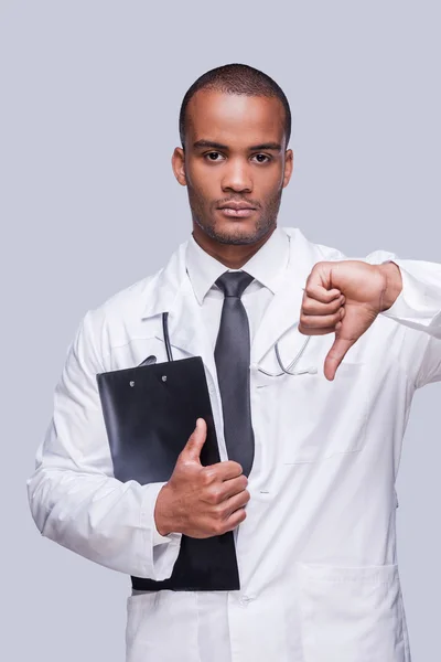 African doctor showing thumb down — Stock Photo, Image