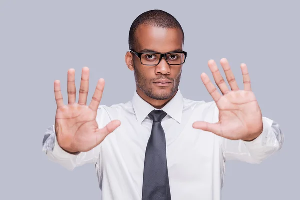 African man in shirt and tie showing his palms — Stock Photo, Image
