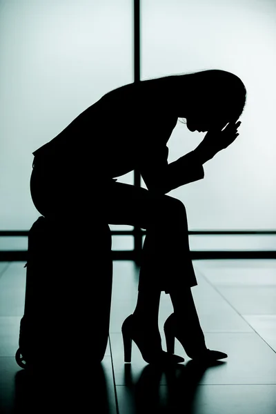 Silhouette of depressed young businesswoman — Stock Photo, Image