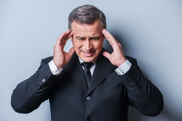 Man in formalwear touching head with fingers — Stock Photo, Image