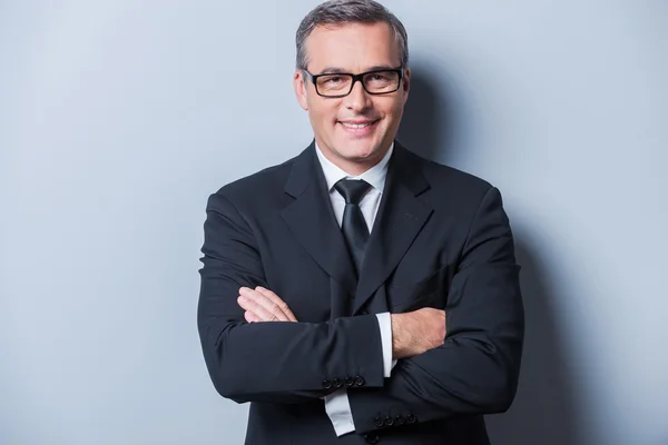 Confident mature man in formalwear and eyeglasses — Stock Photo, Image