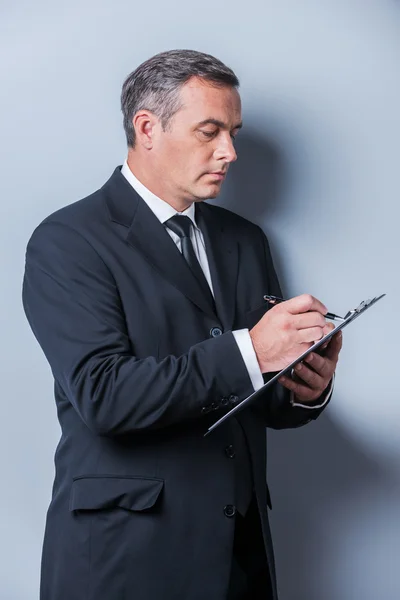 Businessman making notes. — Stock Photo, Image