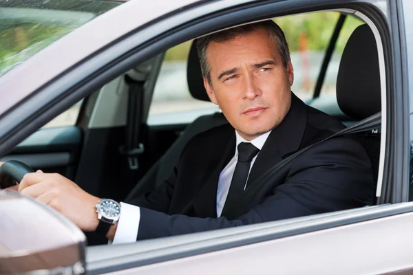 Mature businessman driving car — Stock Photo, Image