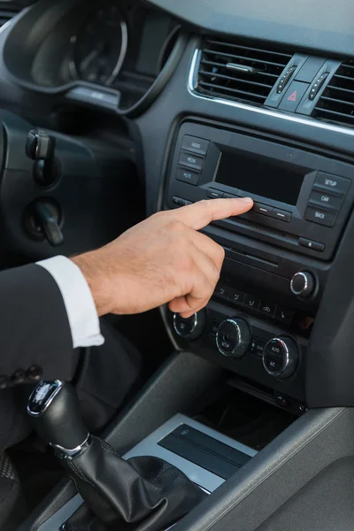 Man in formalwear touching dashboard — Stock Photo, Image