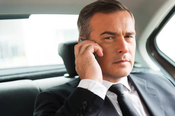 Successful businessman in car — Stock Photo, Image