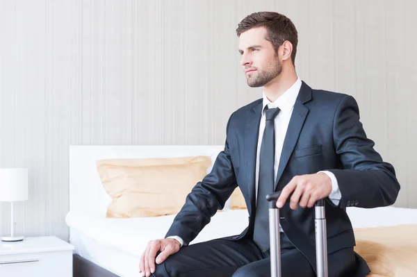 Businessman in formalwear carrying suitcase — Stock Photo, Image