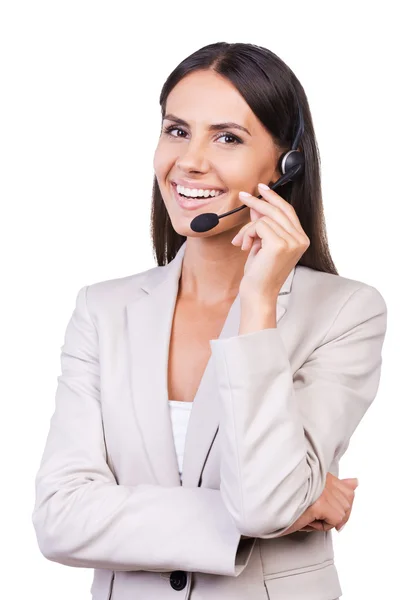 Mujer de negocios ajustando sus auriculares —  Fotos de Stock