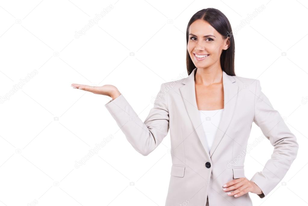 Businesswoman in suit holding copy space