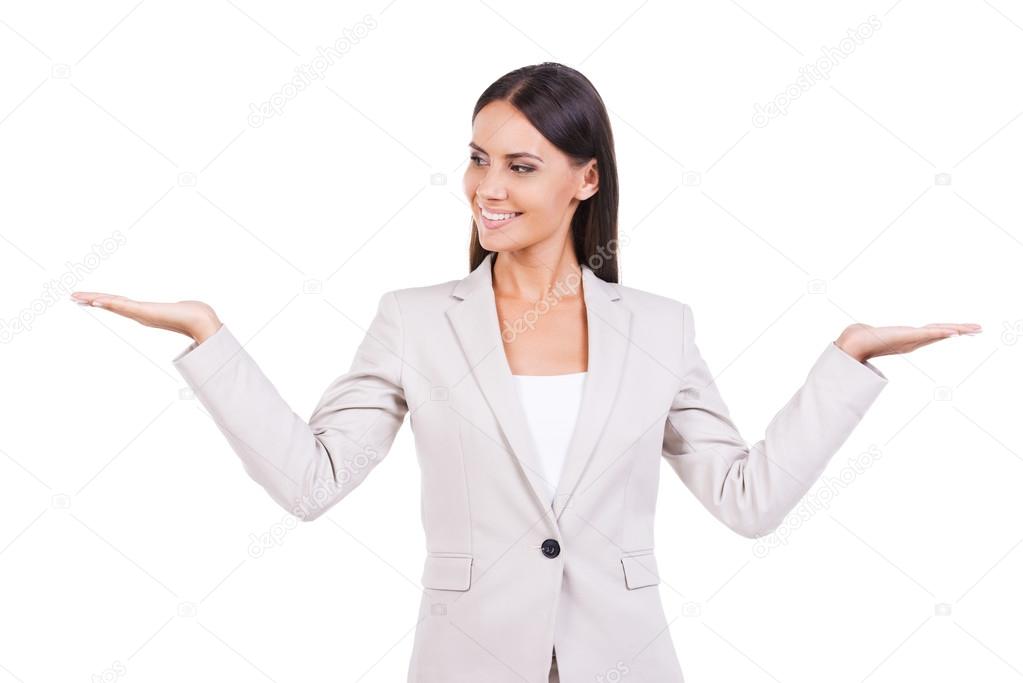 Businesswoman in suit holding copy spaces