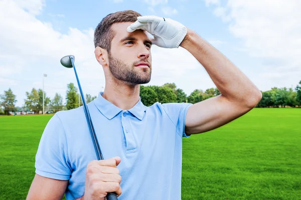 Golfer carrying driver — Stock Photo, Image