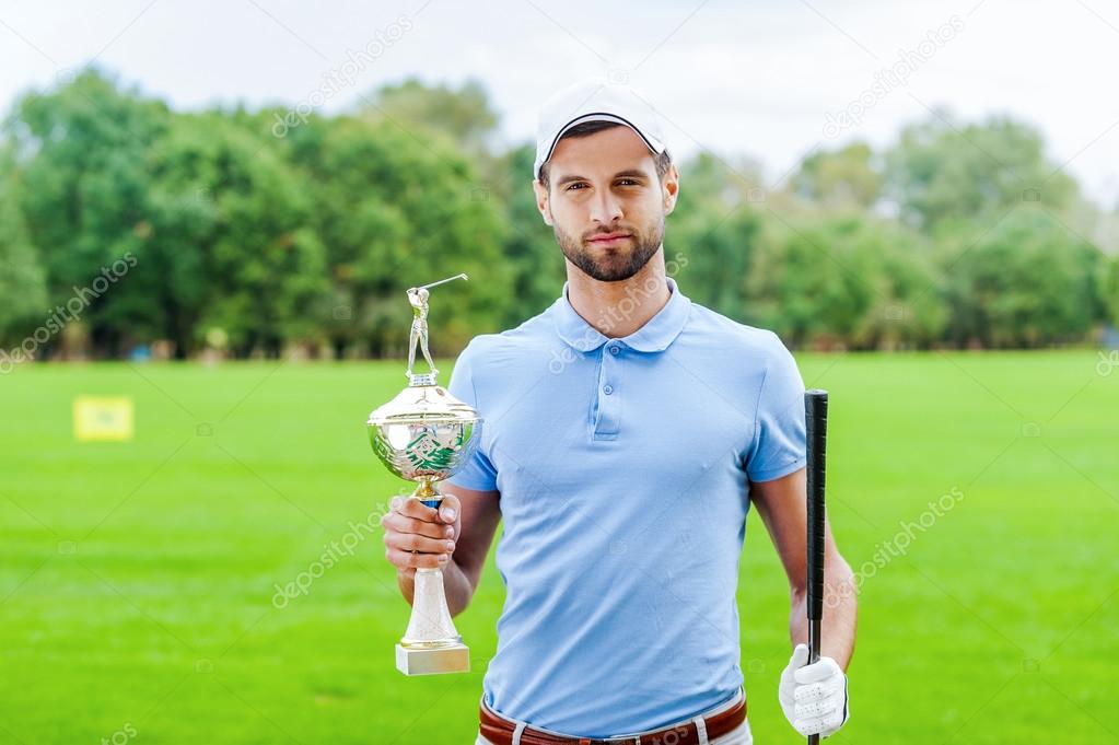 Golfer holding golf ball