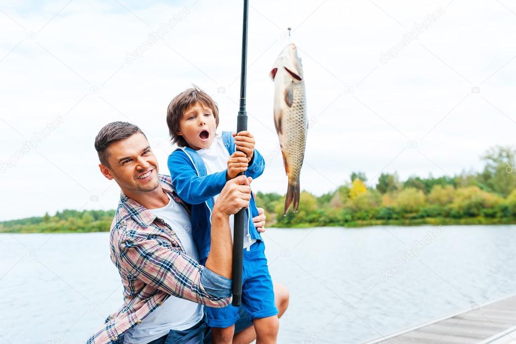 Father and son fishing — Stock Photo © gstockstudio #54244629