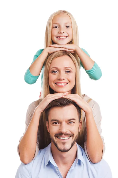 Family of three leaning at each other head — Stock Photo, Image