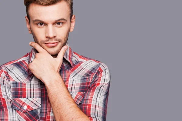 Man holding hand on chin — Stock Photo, Image